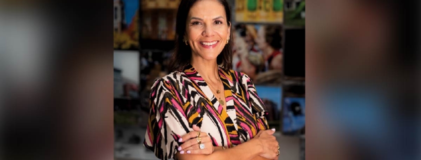Ball State alumna Natalie Vega O’Neil, ’98, smiling with arms crossed, now president and CEO of Junior Achievement of Washington.