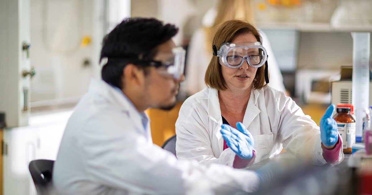 Student and professor in lab
