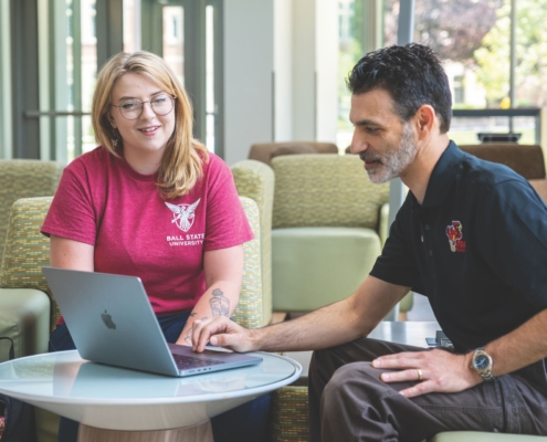 Syndal Hittson and Dr. Michael Tagler looking at laptop