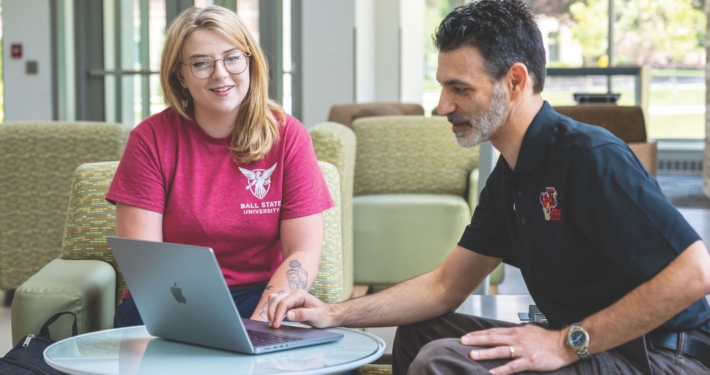 Syndal Hittson and Dr. Michael Tagler looking at laptop