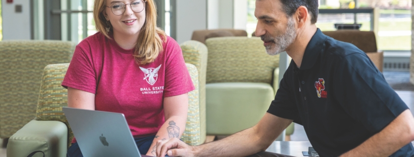 Syndal Hittson and Dr. Michael Tagler looking at laptop