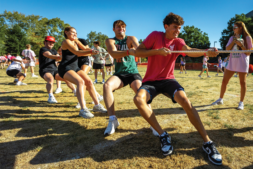 Students at fraternity and sorority event tug a war