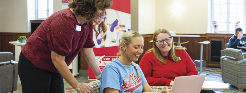 Melisa Stevens and students sitting in student success hub