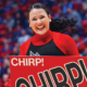 A Ball State cheerleader smiles while holding a sign that reads "Chirp! Chirp!"