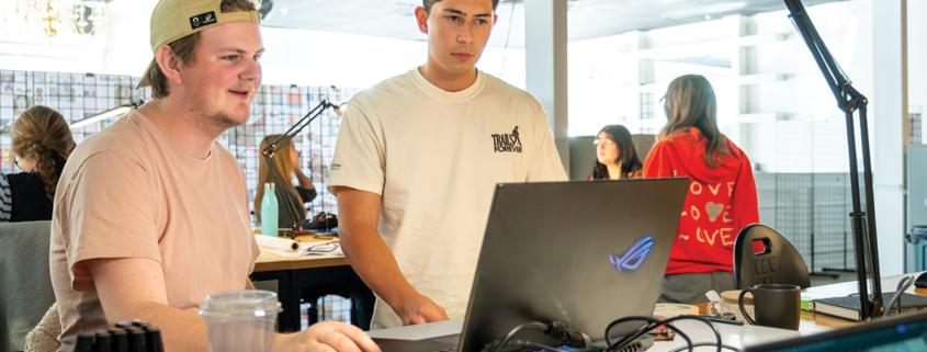 Two students looking at computer screen