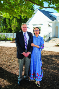 Older couple standing outside
