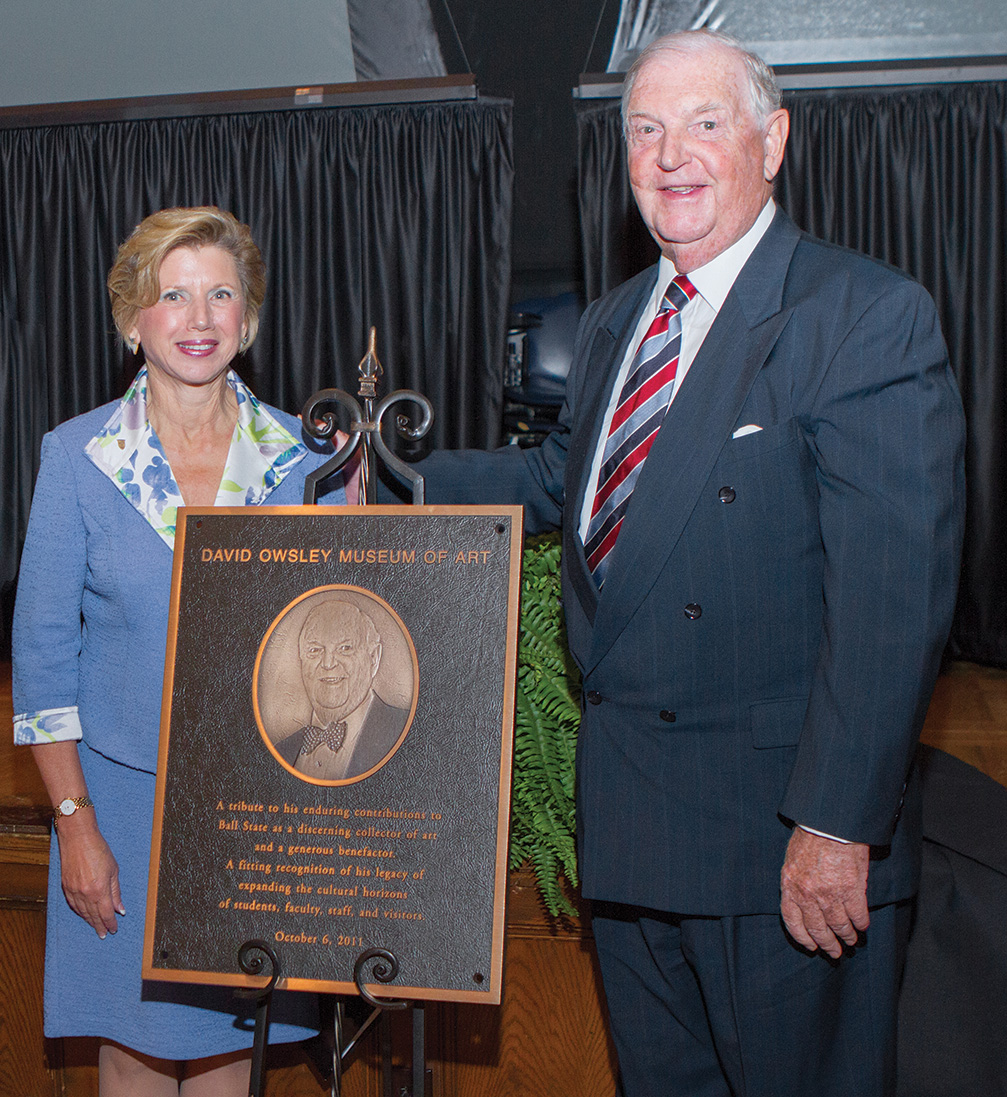 Jo Ann Gora and David Owsley standing near plaque