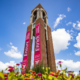 Shafter tower with Spring flowers and a bright blue sky