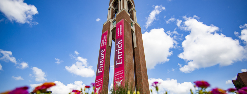 Shafter tower with Spring flowers and a bright blue sky