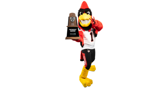Charlie Cardinal holding the cartwright award