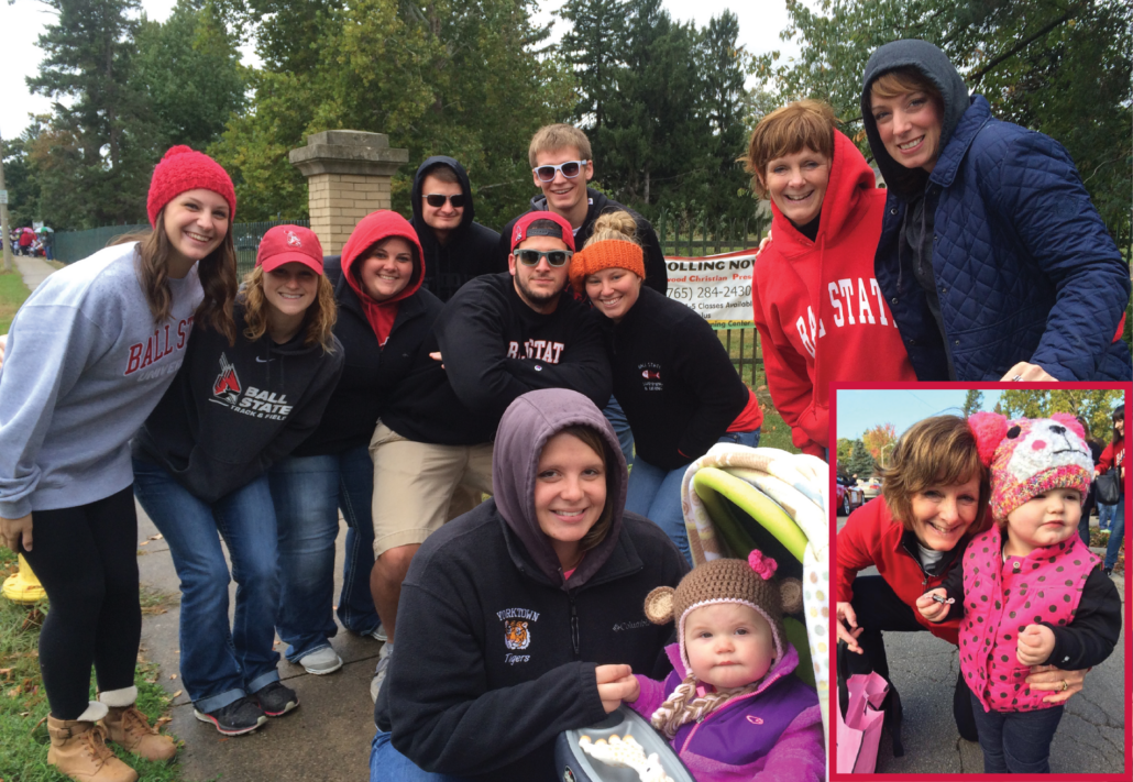 A family poses together outside wearing Ball State apparel.