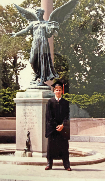 Kevin Lansberry in front of beneficience statue on ball state campus