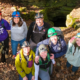 A group photo of several people wearing hiking gear.